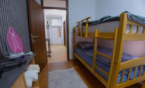 a room with two bunk beds and a hallway at Prishtina Host in Prishtinë