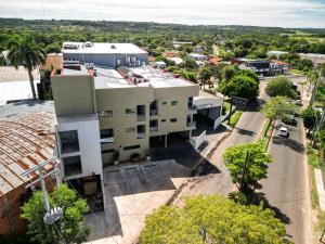 an aerial view of a building in a city at Los Olivos Hotel in San Estanislao