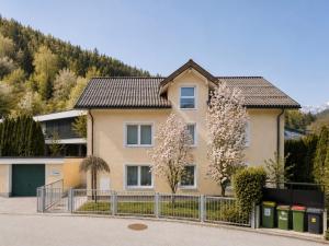 a house with a fence in front of it at Haus OS in Bischofshofen