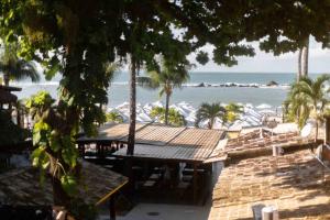 a view of the beach from a resort with a picnic table at Pousada Funny in Morro de São Paulo