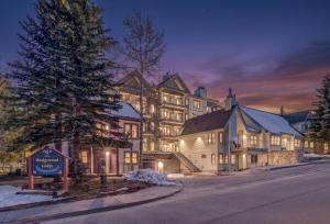 a large building with a sign in front of it at Wedgewood Lodge in Breckenridge