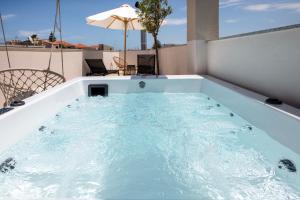 a hot tub on the roof of a house at United Cretan Villas & Spa in Agia Marina Nea Kydonias