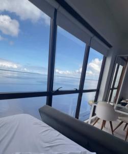 a bedroom with a bed and a view of the ocean at Tropical Executive Hotel N 925 in Manaus