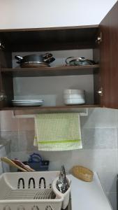 a kitchen with a counter top with a sink at Imani staycations Diani 2 in Diani Beach +3 photos