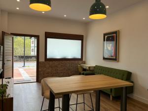 a dining room with a table and two chairs at Tentietxea in Areatza