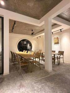 a dining room with a table and chairs at Kashiveli Omadhoo in Omadhoo