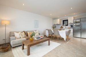 a living room with a couch and a table and a kitchen at Sunset Terrace Vinisce in Vinišće +33 photos