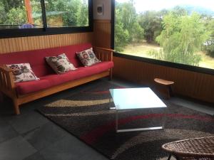 Posezení v ubytování Cabañas El Roble Lican Ray