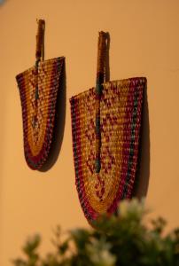 two baskets hanging on a wall at Azorica Pico in Madalena