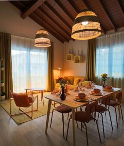 a living room with a table and chairs at Azorica Pico in Madalena