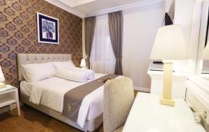 Ένα ή περισσότερα κρεβάτια σε δωμάτιο στο F Hotel Jakarta