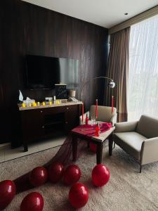 a living room with a couch and a table at Boutique Hotel in Baghdād +13 photos