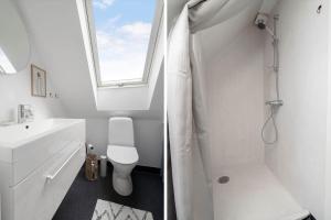 two pictures of a bathroom with a toilet and a window at 20430-Samso-Ballenvej-34A in Ballen