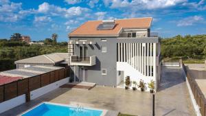 a rendering of a house with a swimming pool at G-Ammos 5 Star Villa by elite in Tragaki