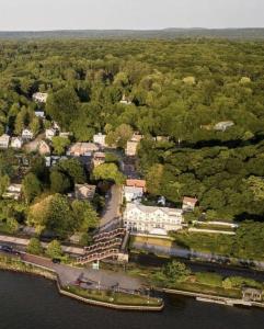 an aerial view of a mansion on the water at Rhinecliff Hotel in Rhinecliff