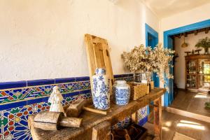 a room with blue and white tiles on a wall at Casa La Portilla in Labarces