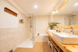 a bathroom with a sink and a shower at Casa La Portilla in Labarces +61 photos