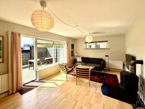 a living room with a couch and a table at 20432-Samso-Klintevej-6 in Ballen