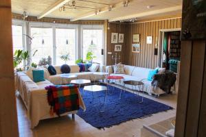 a living room with couches and tables and windows at GOT698-Laerbro-Rute-Sofiero-133 in Lärbro