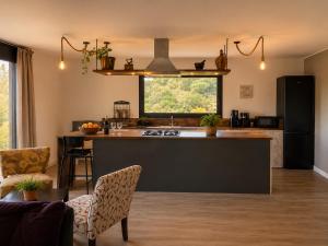 a kitchen with a sink and a counter top at Green House in Llagostera
