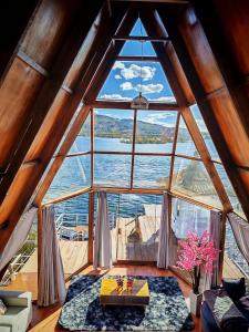 a large window in a room with a view of the water at Titicaca Star Perú in Puno