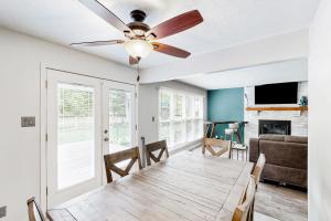 a dining room with a table and a ceiling fan at 'Heart Pond Resort' Home in Carmel-Westfield Area in Carmel