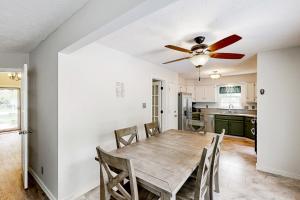 a dining room with a table and a ceiling fan at 'Heart Pond Resort' Home in Carmel-Westfield Area in Carmel