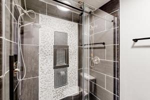 a bathroom with a shower with a toilet at 'Heart Pond Resort' Home in Carmel-Westfield Area in Carmel +17 photos