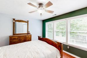 a bedroom with a bed and a ceiling fan at 'Heart Pond Resort' Home in Carmel-Westfield Area in Carmel