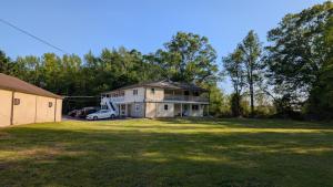 a house with a car parked in a yard at Red Lion Motel Southampton in Southampton +43 photos