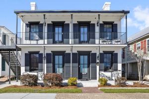 an exterior view of a building with a balcony at Old Spanish House Suite C Downtown Retreat in Biloxi