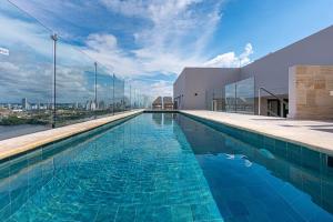 a swimming pool on the roof of a building at Stylish Duplex Loft - Panoramic Rooftop Pool in Cartagena de Indias