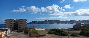 a view of a body of water with buildings at Ocean View Studio 4 in Mindelo