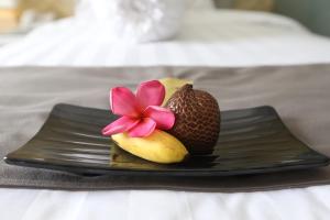 Ένα ή περισσότερα κρεβάτια σε δωμάτιο στο F Hotel Jakarta