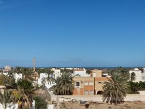 a view of a city with palm trees and buildings at Taguermess Tag 8 in Taguermess