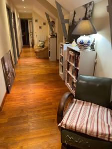 a living room with a couch and a chair at Les Terrasses de Rostevel in Brech
