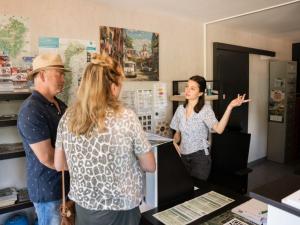 a man and a woman standing in a room at Appartement confortable avec cuisine équipée - API-1-52-759 in Granges-Aumontzey +28 photos
