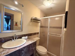 a bathroom with a sink and a toilet and a shower at Hotel Marina Loreto in Loreto +97 photos