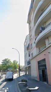 a car driving down a street next to a building at AMOUR PARIS -Orly 10min Bus -RER C Tram T9 in Vitry-sur-Seine +6 photos