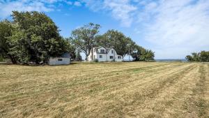 an empty field in front of a house at The Majestic Oasis in Vineland Station
