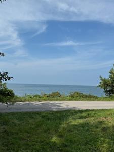 a road with the ocean in the background at The Majestic Oasis in Vineland Station
