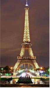 a view of the eiffel tower at night at AMOUR PARIS -Orly 10min Bus -RER C Tram T9 in Vitry-sur-Seine