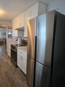 a kitchen with a large stainless steel refrigerator at 2BR House Perfect for Olympic NP Adventures in Port Angeles