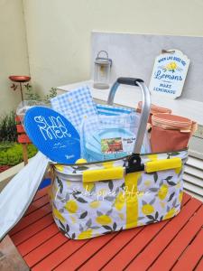a suitcase sitting on top of a table at L'Échappée Bleue, maison à 200m de la mer pour vacances et travail in Saint-Brevin-les-Pins