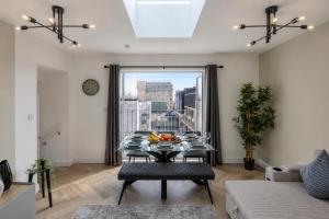 a living room with a table with fruit on it at Luxe By The Sea - Luxury in the Centre of Brighton - Aparthotel - 3 Beautiful Apartments - Penthouse Available in Brighton & Hove