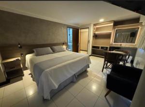 a large bedroom with a large bed and a table at Hotel Paris in Balsas