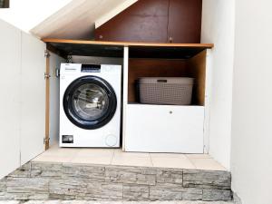 a washer and dryer sitting inside of a house at Kaza LYBS in Fort-de-France