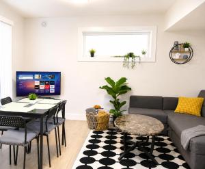 a living room with a couch and a table at Centrally Located Modern Suite in North Vancouver