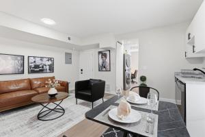 a living room with a couch and a table at Keifer Suite in Detroit