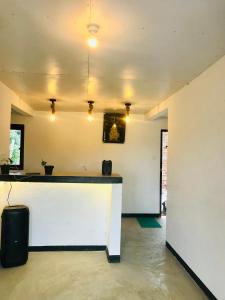 a bar in a room with a counter in the middle at Sambu Cabana Panama in Panama